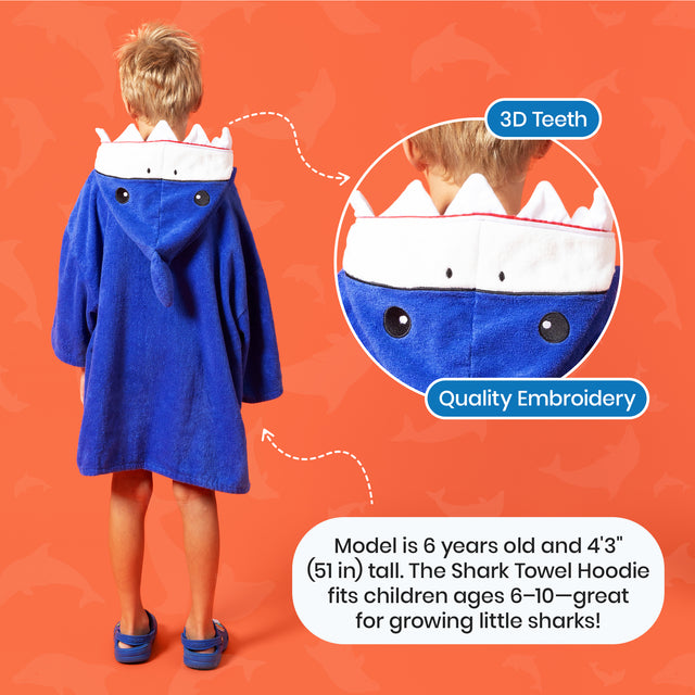 Child wearing a blue shark towel hoodie with text highlighting features on an orange background
